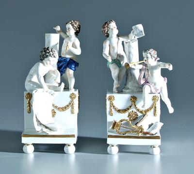 Appraisal: Pair porcelain figural bookends putti on stepped bases with implements