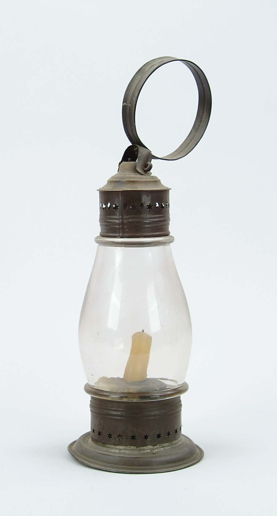 Appraisal: TIN AND GLASS CANDLE LANTERN Clear glass font has applied