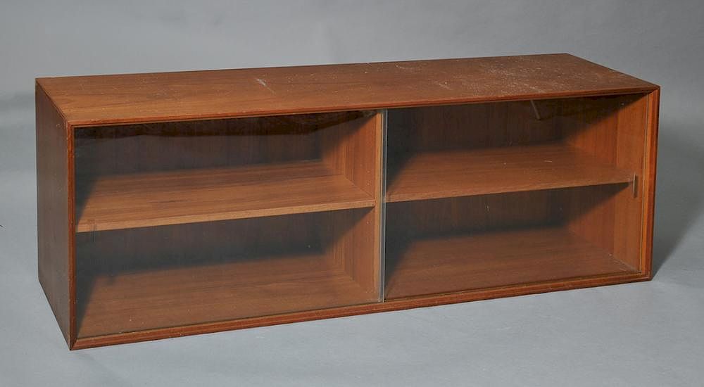 Appraisal: Elongated horizontal Danish teak bookcase with removable sliding glass doors