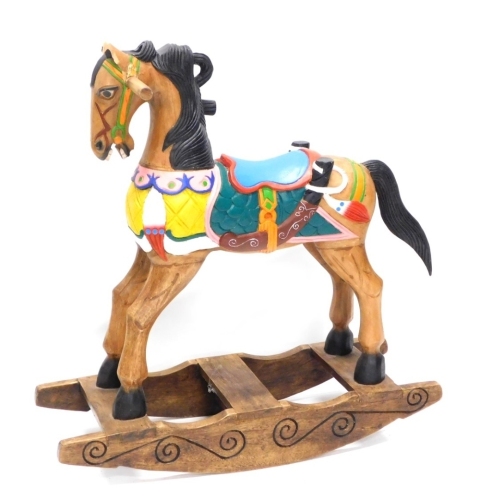 Appraisal: A modern wooden rocking horse painted in colours on a