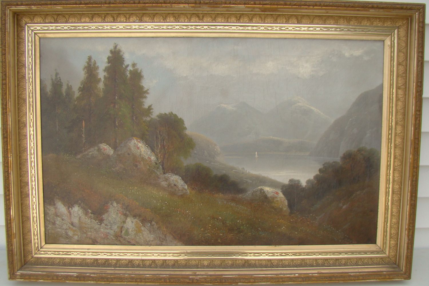 Appraisal: FRAMED HUDSON RIVER-STYLE PAINTING A rocky field by a lake