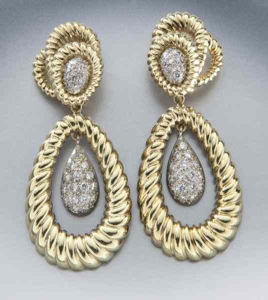 Appraisal: K gold and diamond convertible dangle earringsmounted with round brilliant