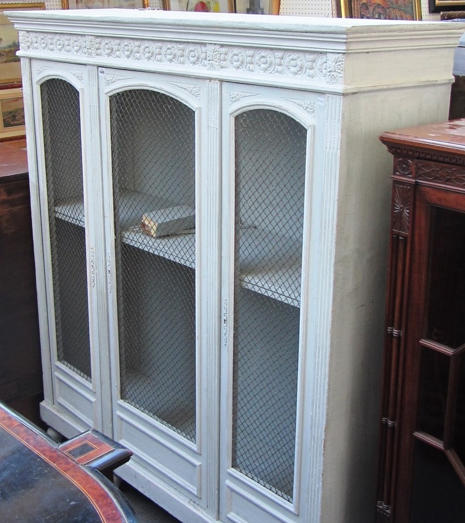 Appraisal: A th century French pale green painted three door cupboard