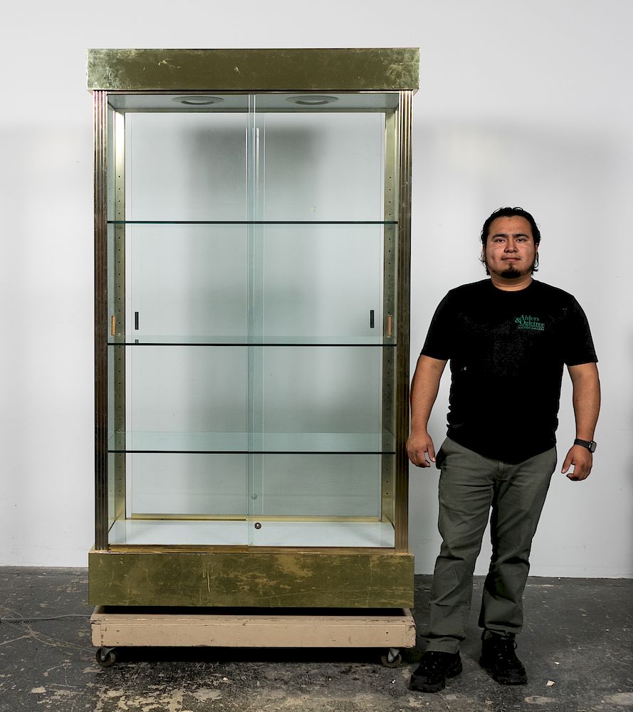 Appraisal: Brass Glass Display Cabinet A brass glass display cabinet with