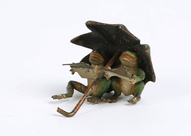 Appraisal: A COLD PAINTED MINIATURE BRONZE of two frogs seated under