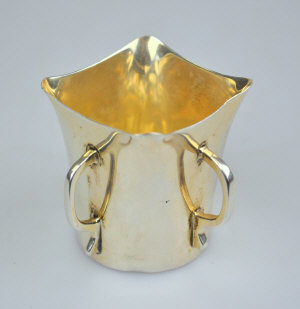 Appraisal: A small four-handled posy vase in the Arts Crafts manner