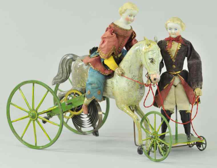 Appraisal: BISQUE HEAD FIGURES WITH HORSE France clockwork activated toy depicts