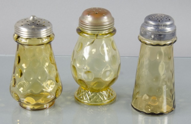 Appraisal: Three Vintage Sugar ShakersEach in amber glass with internal thumbprints