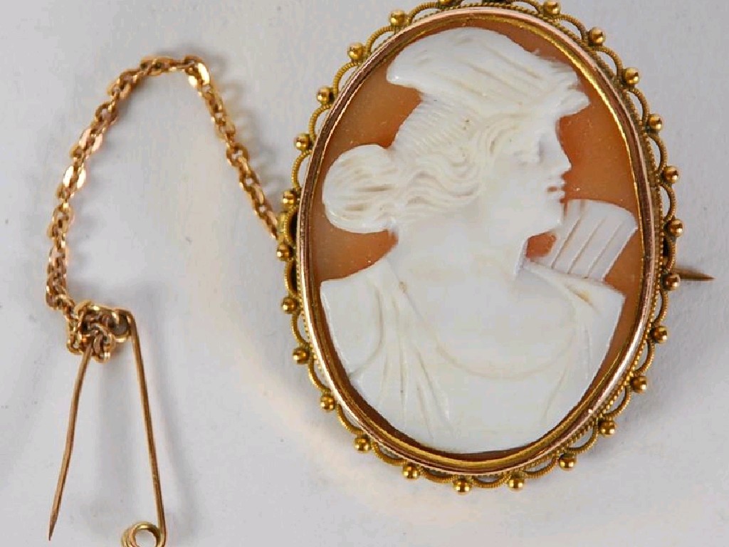 Appraisal: ct GOLD FRAMED SHELL CAMEO BROOCH depicting Diana The Huntress