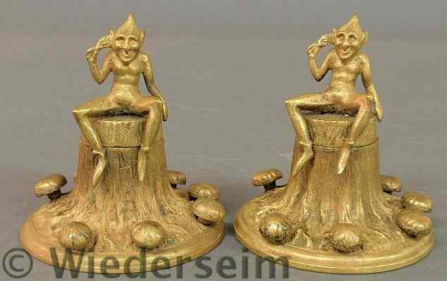 Appraisal: Pair of unusual bronze inkwells of elfin figures sitting on