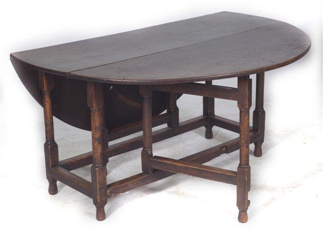 Appraisal: th CENTURY OAK GATELEG DINING TABLE the oval top raised