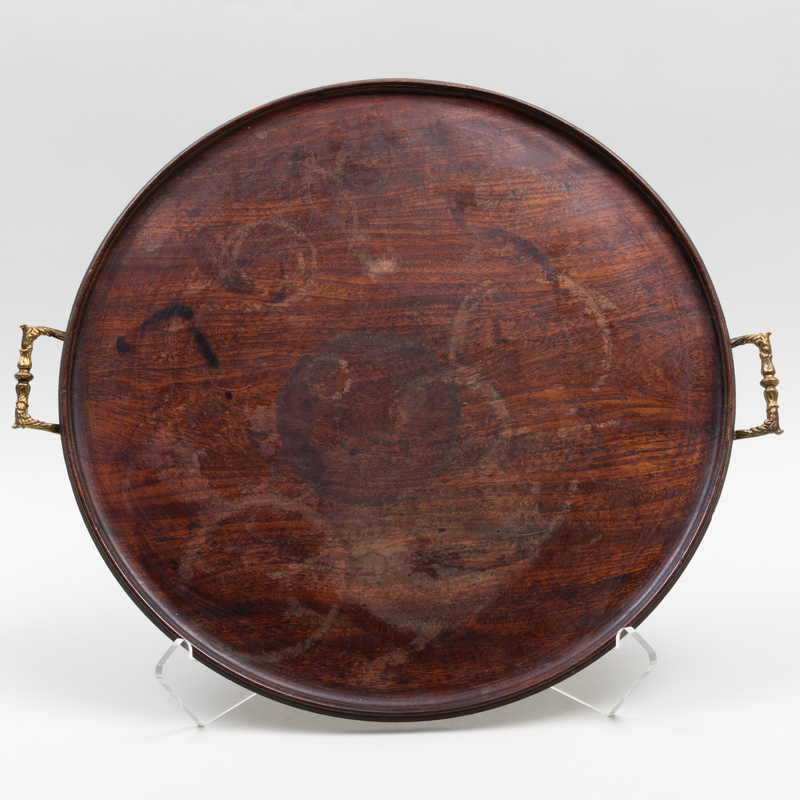 Appraisal: BRASS-MOUNTED CIRCULAR MAHOGANY TRAY The tray x in Condition The