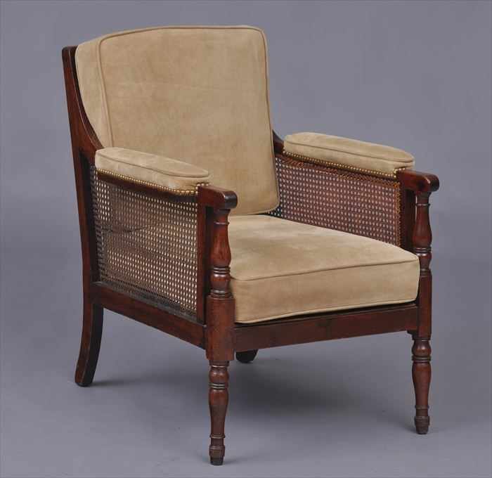 Appraisal: REGENCY MAHOGANY LIBRARY ARMCHAIR With curved cane back padded arms