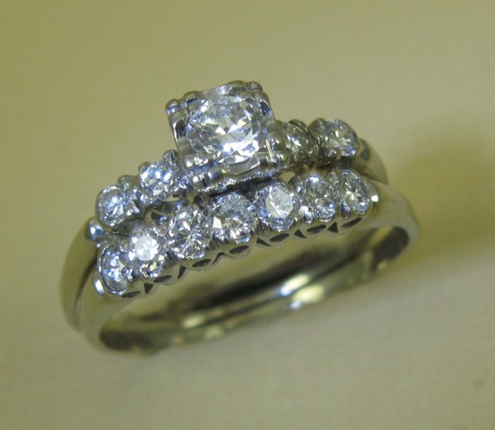 Appraisal: DIAMOND AND FOURTEEN KARAT WHITE GOLD WEDDING RING ENSEMBLE comprising