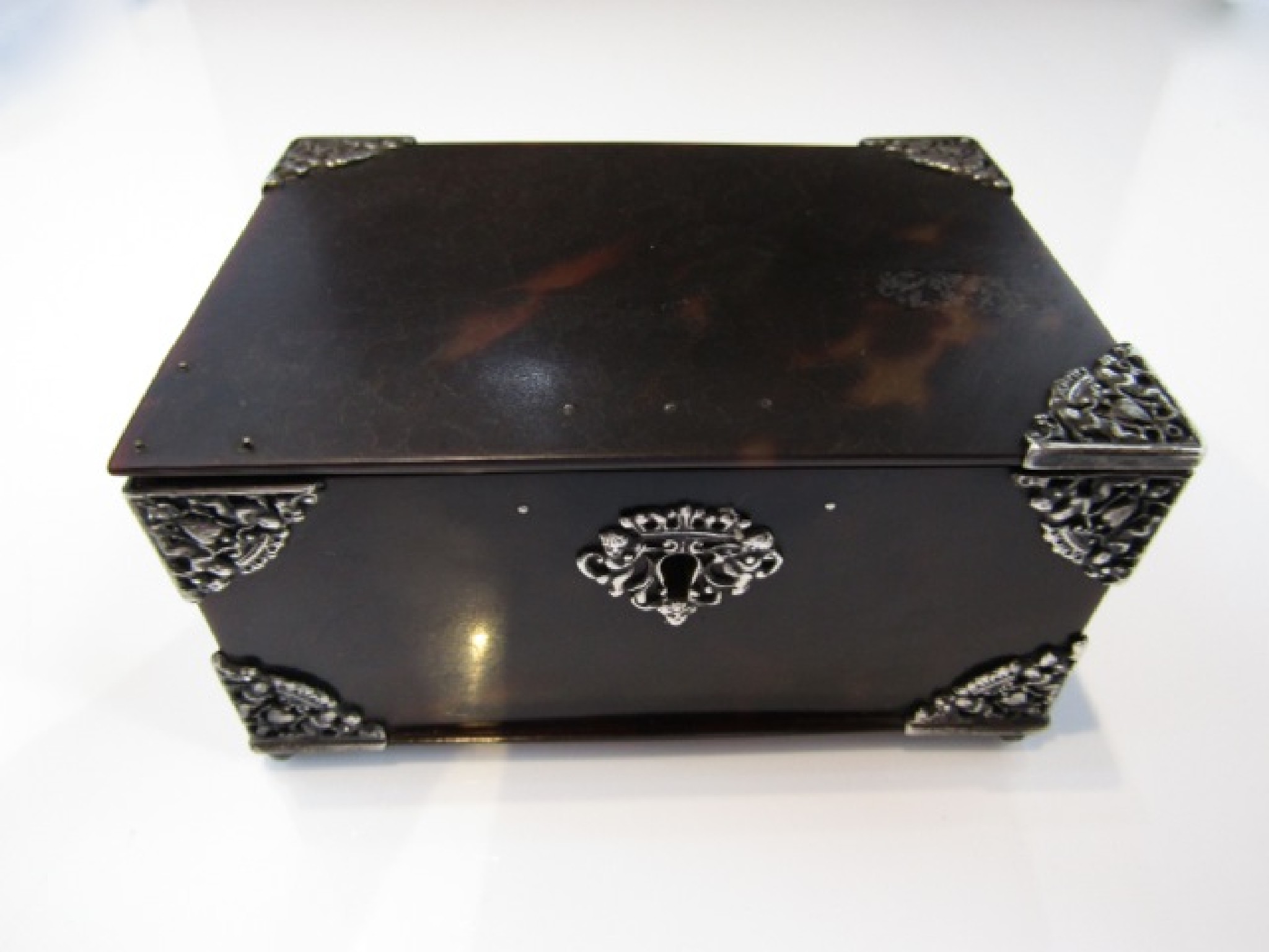 Appraisal: A silver-mounted tortoiseshell box apparently unmarked of rectangular form each