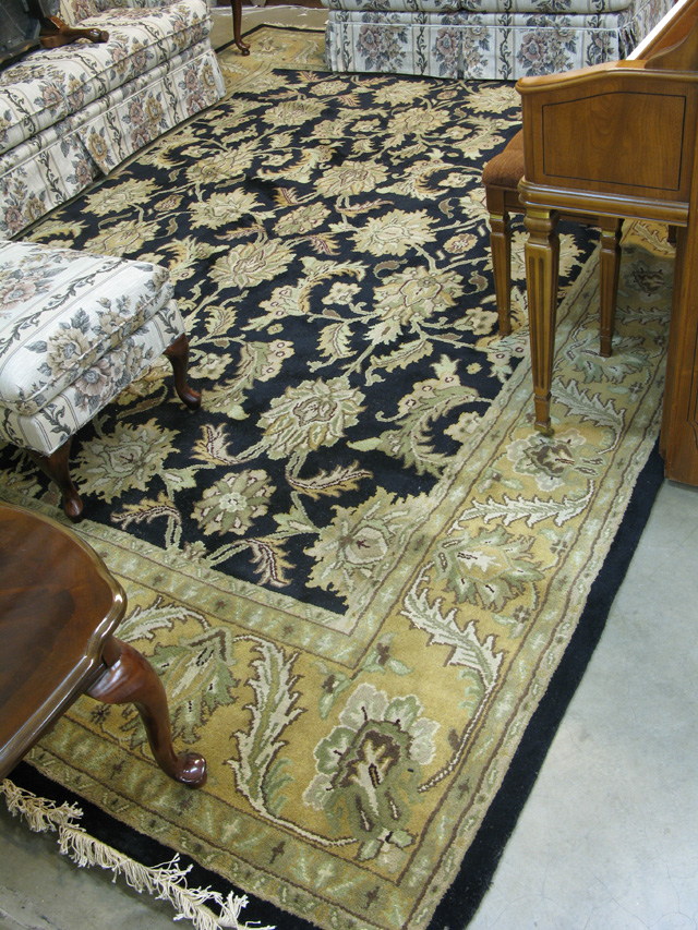 Appraisal: LARGE ORIENTAL CARPET Indo-Persian overall floral arabesque decoration on black