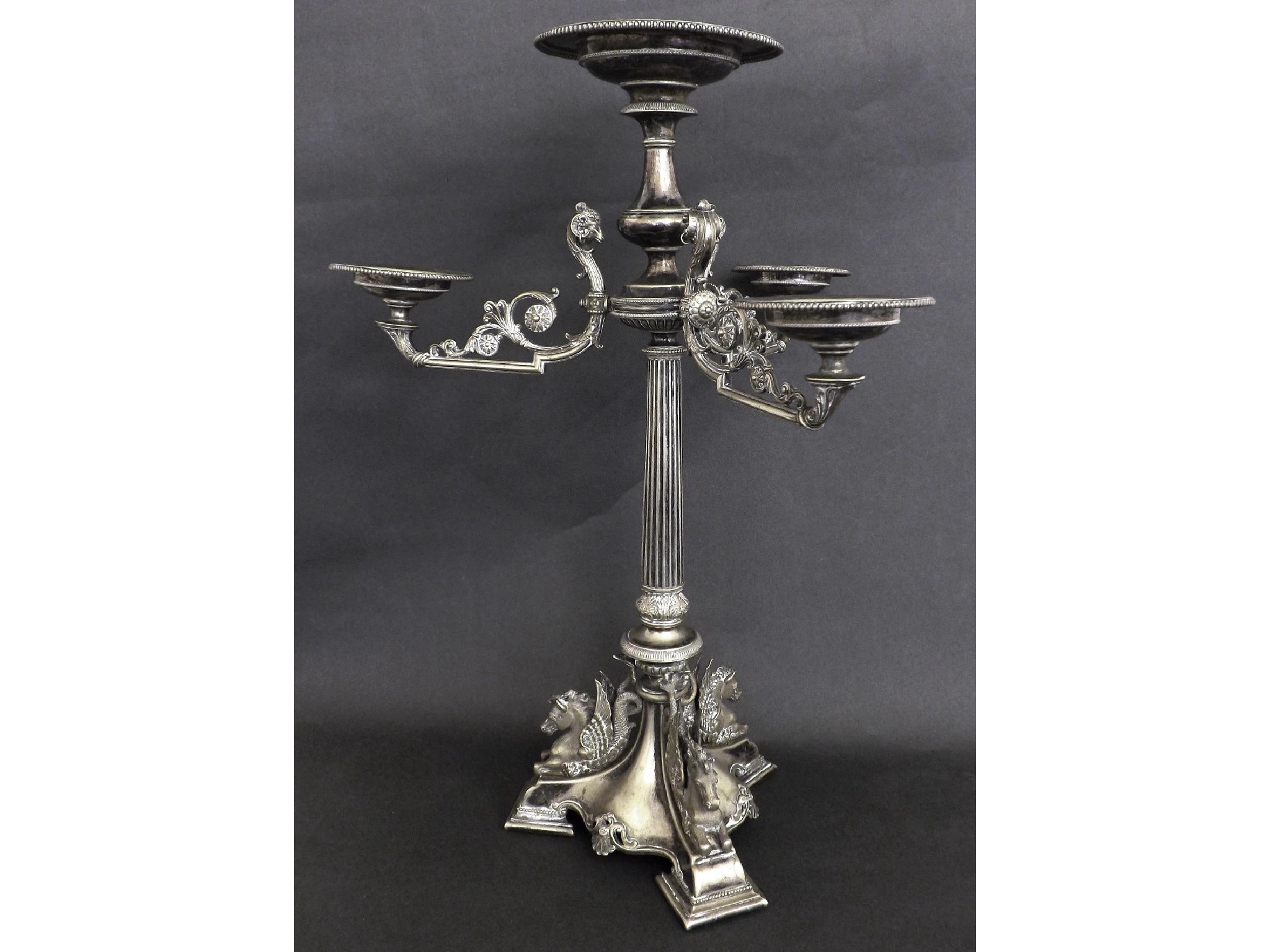 Appraisal: th century silver plated three branch epergne in the Adams