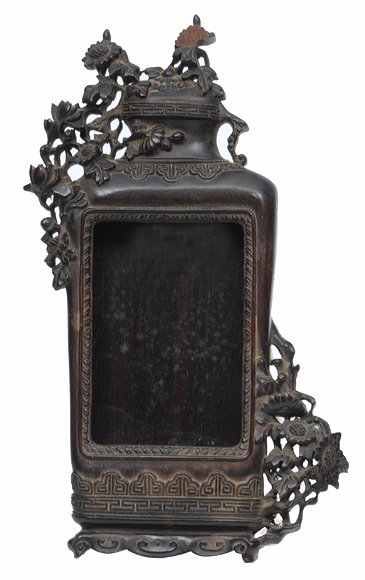 Appraisal: A TH CENTURY ORIENTAL CARVED HARDWOOD PICTURE FRAME in the