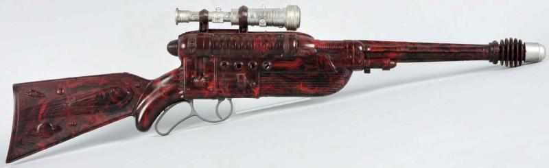 Appraisal: Plastic Space Rifle Toy Description American Unusual marbelized plastic with