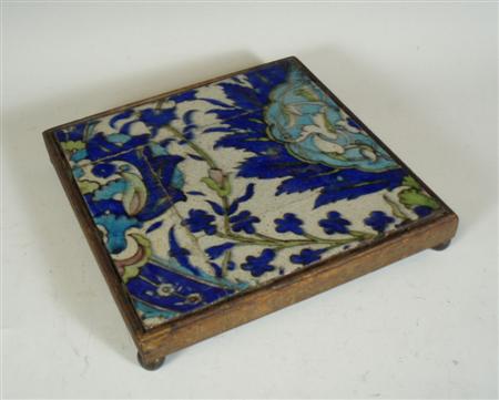 Appraisal: A framed Middle Eastern tile decorated in blue and turquoise