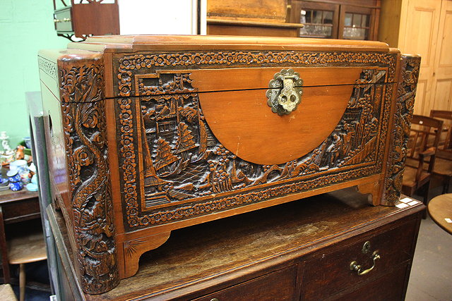 Appraisal: A MID TH CENTURY ORIENTAL CAMPHOR WOOD CHEST with carved