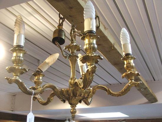 Appraisal: AN ORNATE FIVE BRANCH BRASS CHANDELIER