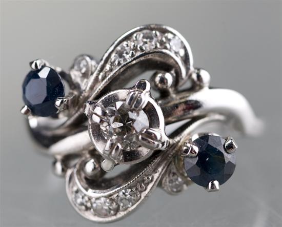 Appraisal: KT white gold sapphire and diamond ring Ring center is