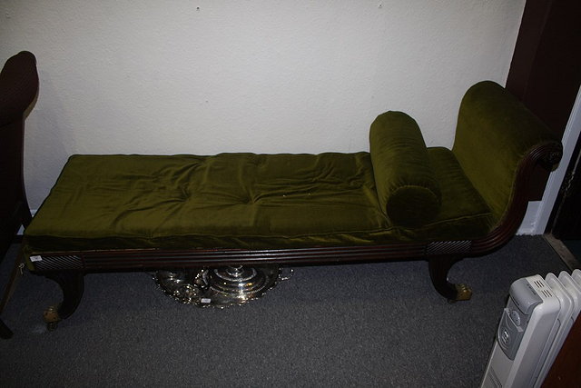 Appraisal: A REGENCY MAHOGANY DAY BED with reeded frame and brass