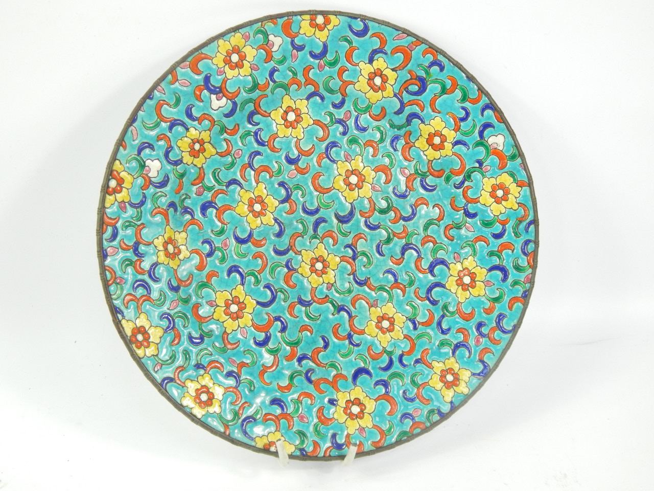 Appraisal: A Longwy Pottery plate enamel decorated with flowers against a