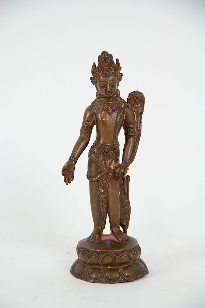 Appraisal: A Nepalese Bronze Figure of Maitreya The bodhisattva stands atop