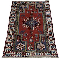 Appraisal: A Kazak Area Rug Overall bold geometric design featuring a