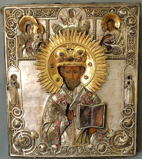 Appraisal: Russian icon painted on panel face and silver and gilt