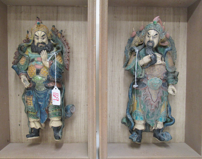 Appraisal: PAIR CHINESE POTTERY ROOF TILES MOUNTED IN SHADOWBOXES the sculptures