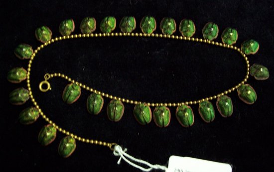 Appraisal: A necklet of green iridescent beetles