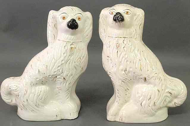 Appraisal: Two large Staffordshire seated white spaniels c h