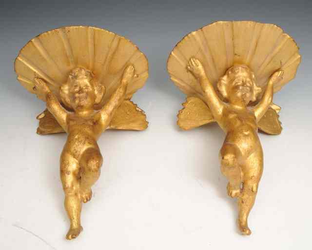 Appraisal: A PAIR OF GILT WALL BRACKETS in the form of