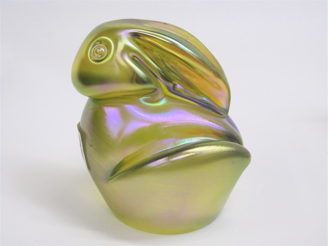 Appraisal: ORIENT FLUME ART GLASS RABBIT PAPERWEIGHT hand-blown iridescent yellow with