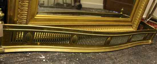 Appraisal: A George III Adam design pierced serpentine brass fender in