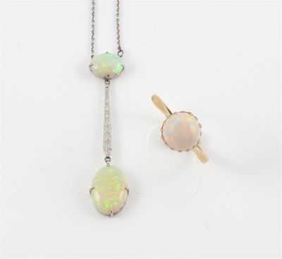 Appraisal: A white gold pendant set with two white opals on