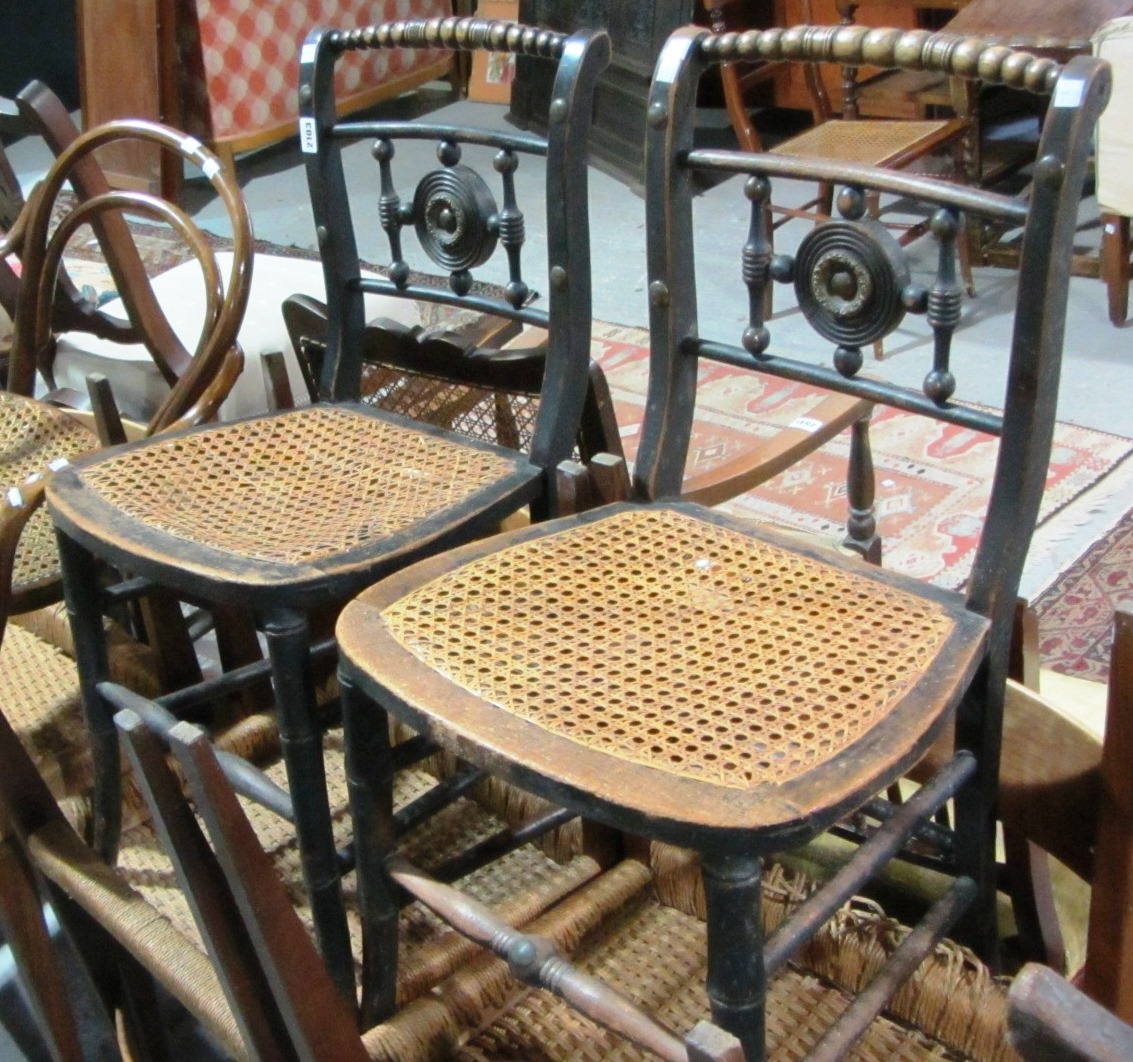 Appraisal: A pair of th century ebonised side chairs and a