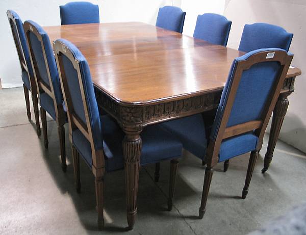 Appraisal: A Neoclassical style walnut dining suite comprising a table and