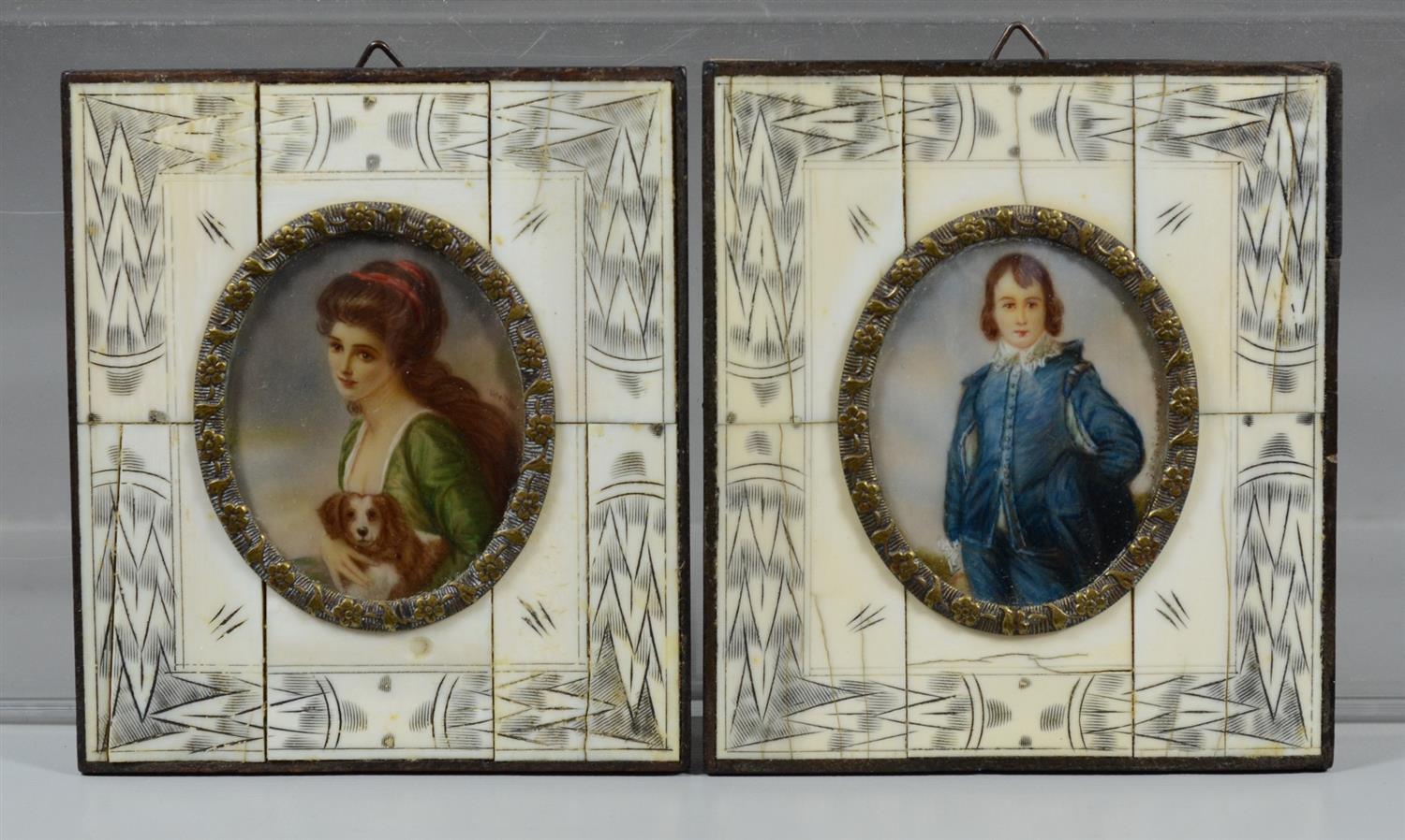 Appraisal: th c hand painted portraits on ivory in ivory veneered