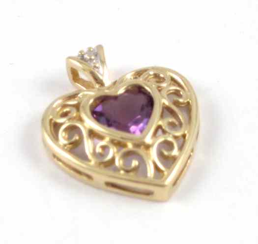 Appraisal: AMETHYST AND DIAMOND HEART SHAPED PENDANT k yellow gold featuring