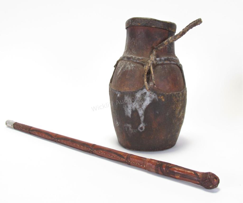 Appraisal: African Leather Riding Crop and Porridge Pot tooled crop with