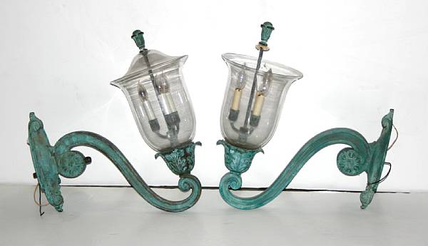 Appraisal: A pair of patinated bronze and blownglass wall lanterns th