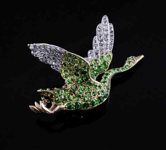 Appraisal: An Edwardian gold diamond and demantoid garnet flying swan brooch