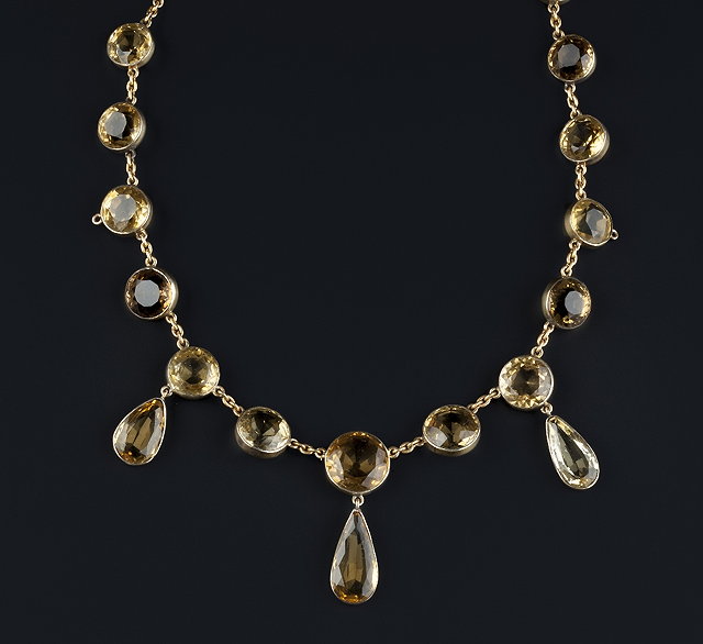 Appraisal: A citrine pendant necklace of rivi re design comprising a