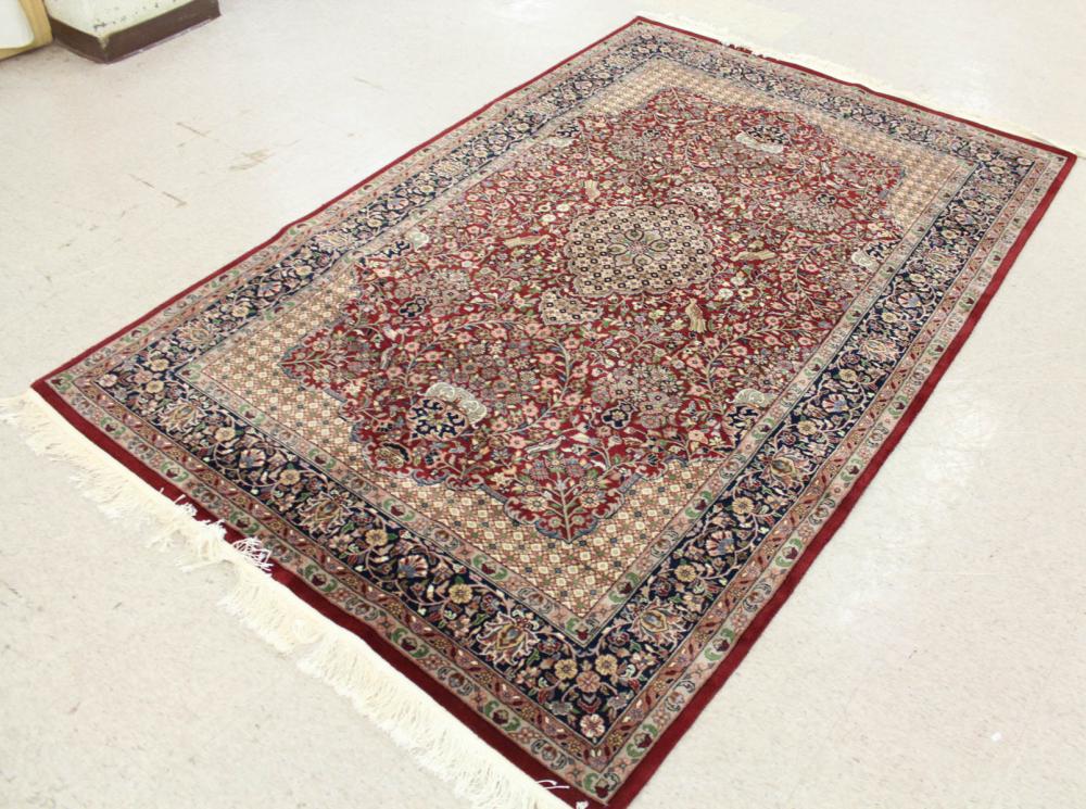 Appraisal: HAND KNOTTED ORIENTAL RUG Indo-Persian floral and central floral medallion