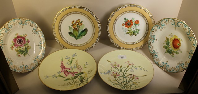 Appraisal: A PAIR OF MINTON WHITE GROUND PORCELAIN PLATES the centre