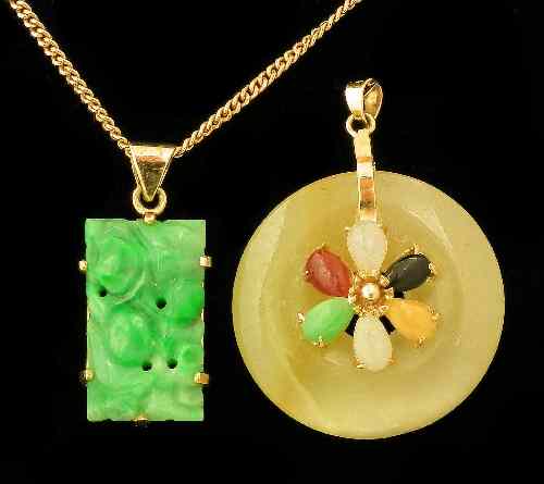 Appraisal: A modern Chinese green jadeite oblong pattern pendant with ct